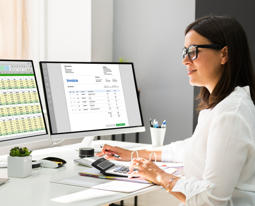 Side view of a woman on computer using financial software